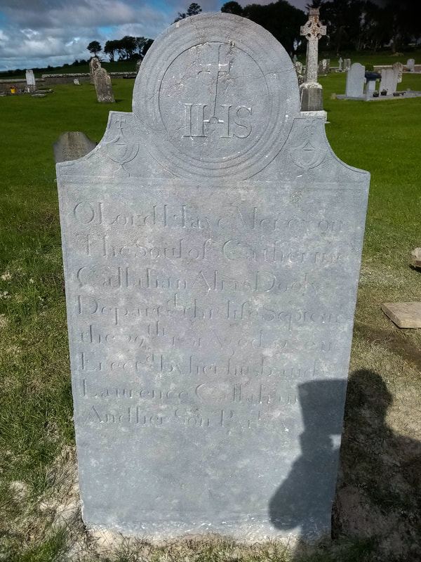 After picture of cross headstone with all lettering and symbols now restored and visible.