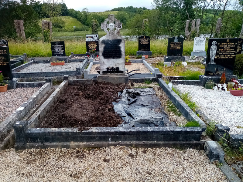 Before picture of cross headstone restoration.