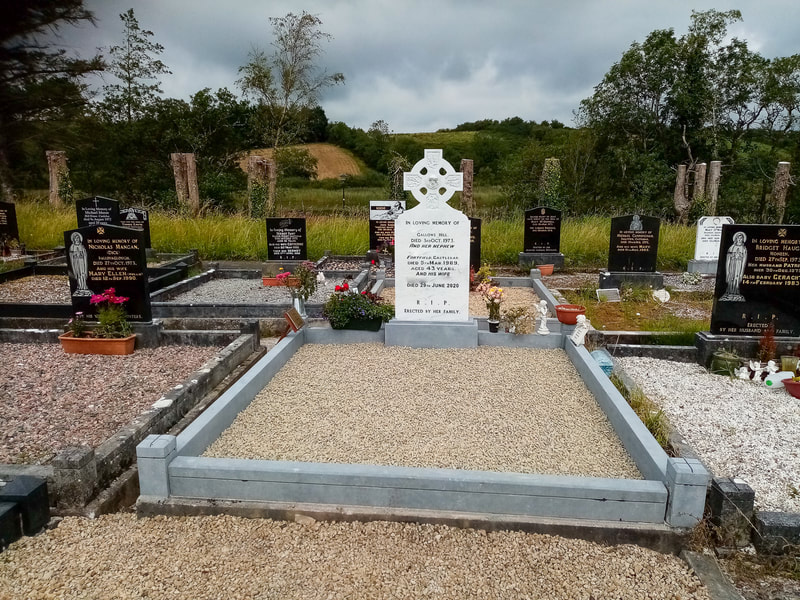 After picture of cross headstone with all lettering and symbols now restored and visible. All kerbing also restored.