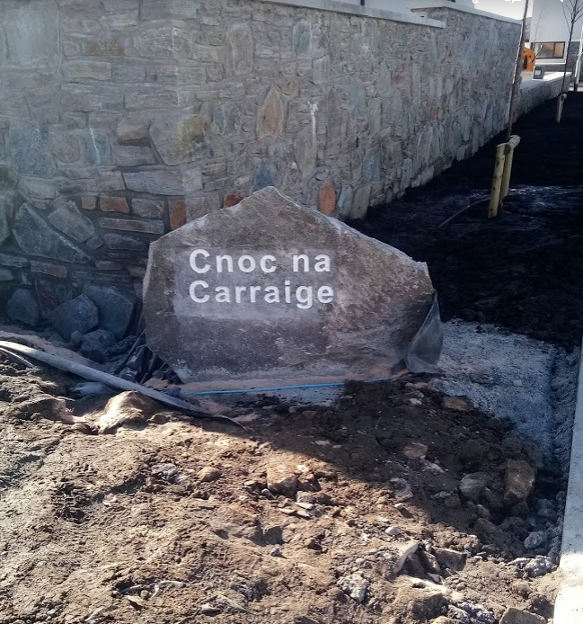 Stone sign at the entrance to a housing estate